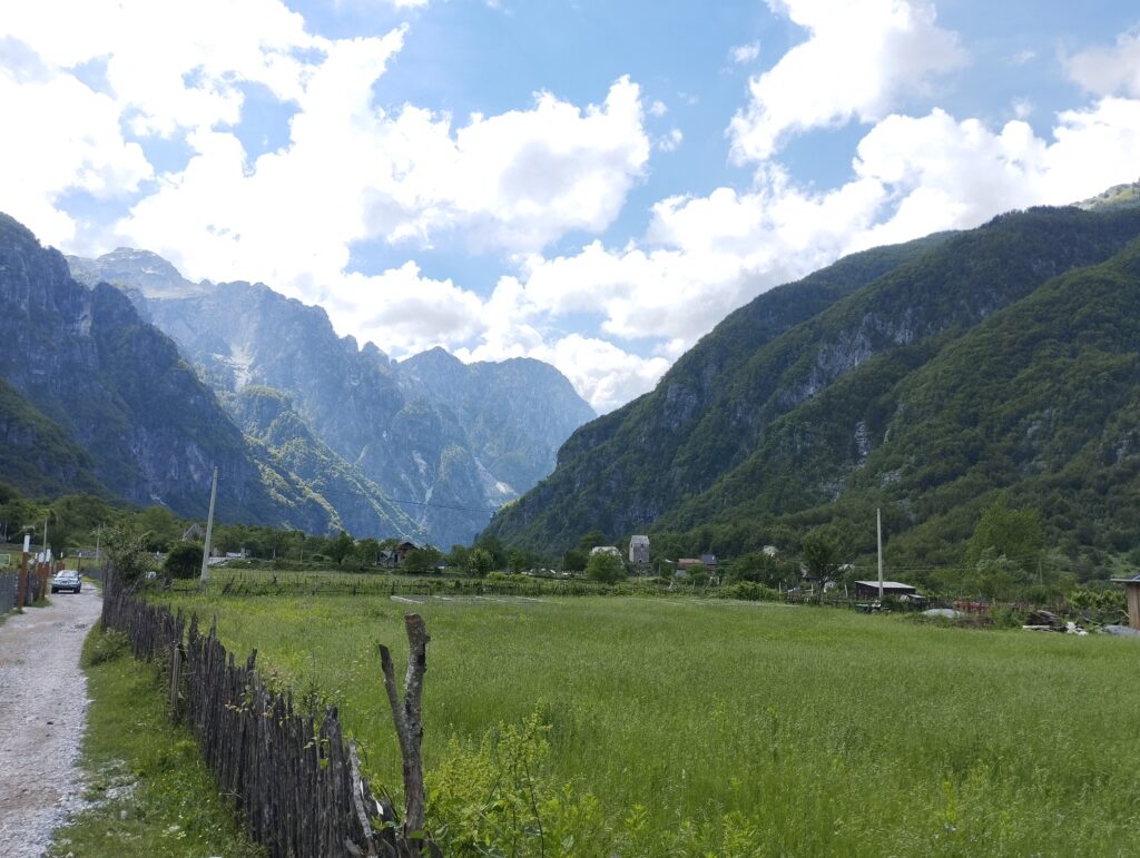 Theth valley surrounded by Albanian Alps mountains on a clear summer day